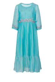Turquoise A-line midi dress with floral embroidery at waist and sleeves, sheer lightweight fabric, ruffled hem, front view