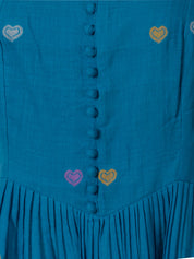 Teal cotton maxi dress with colorful heart embroidery and buttoned front, close-up view