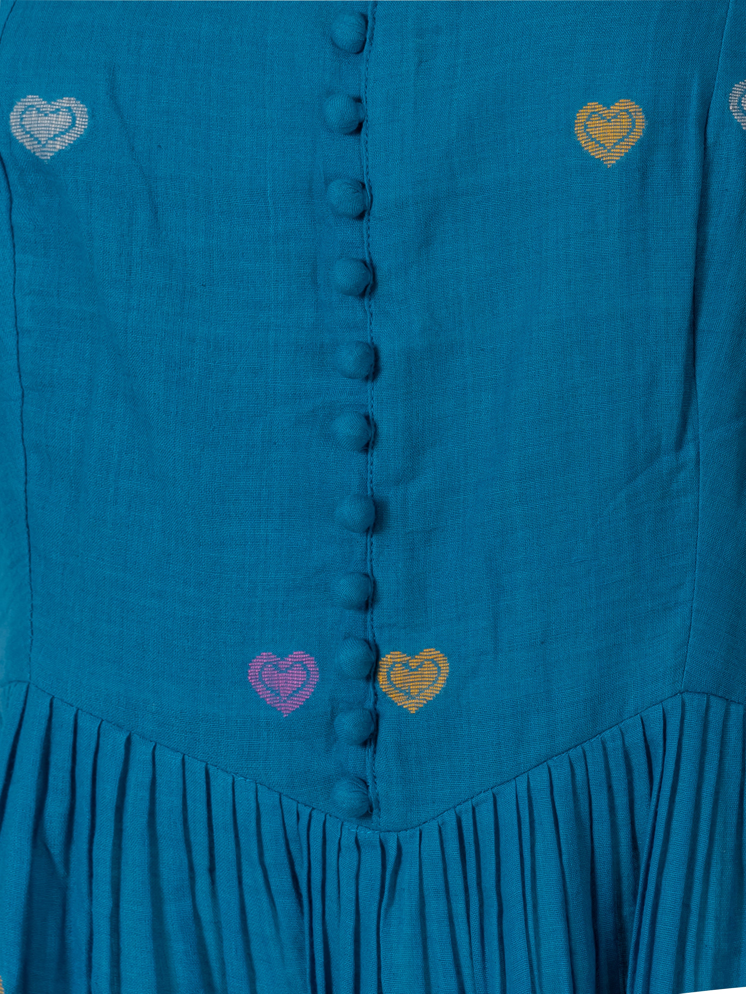 Teal cotton maxi dress with colorful heart embroidery and buttoned front, close-up view