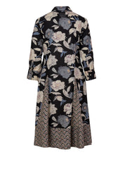 Black cotton shirt dress with floral and chevron print, back view, long sleeves, flared skirt, button cuffs