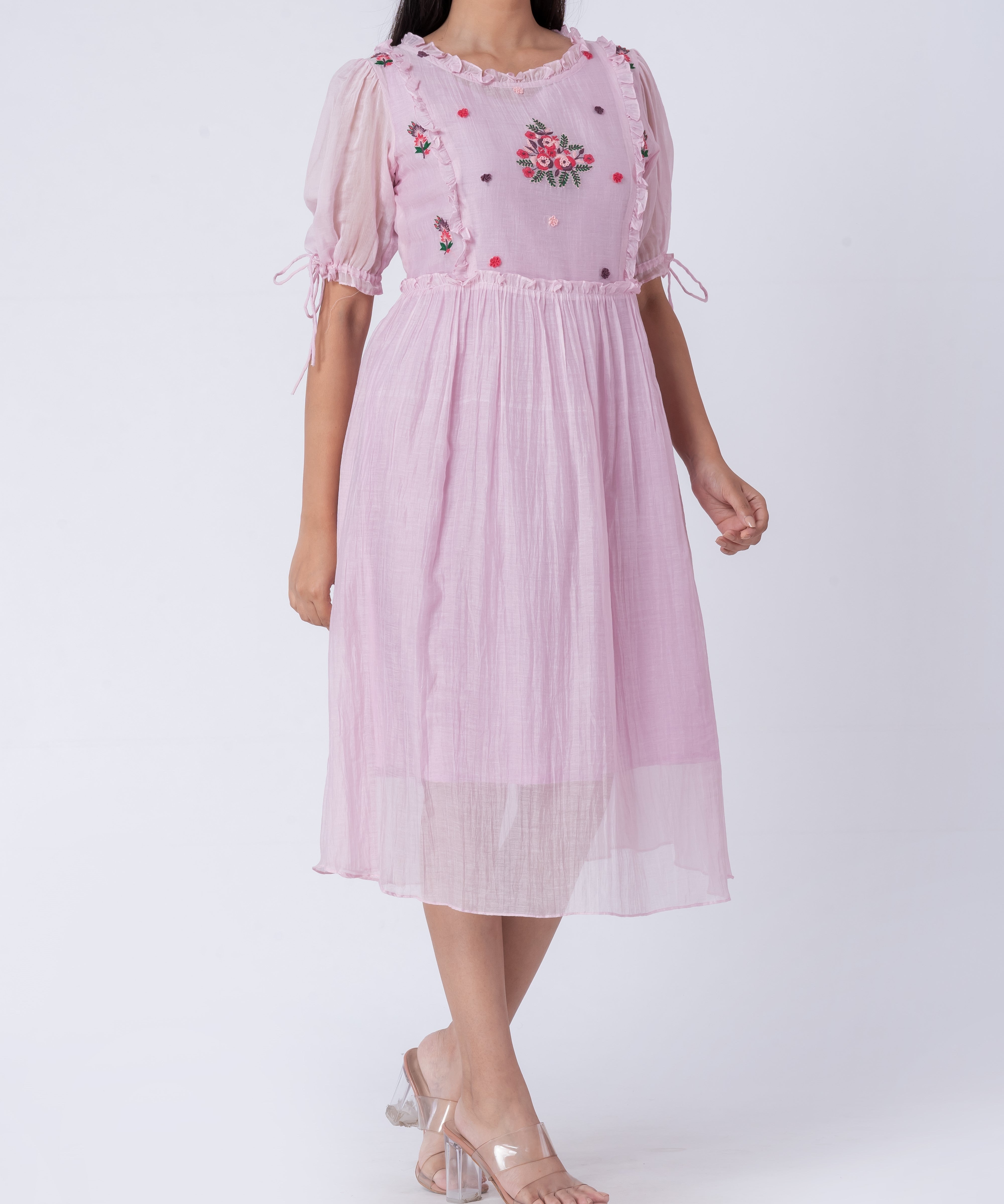  Front view of hand-embroidered floral cotton silk midi dress with puff sleeves.