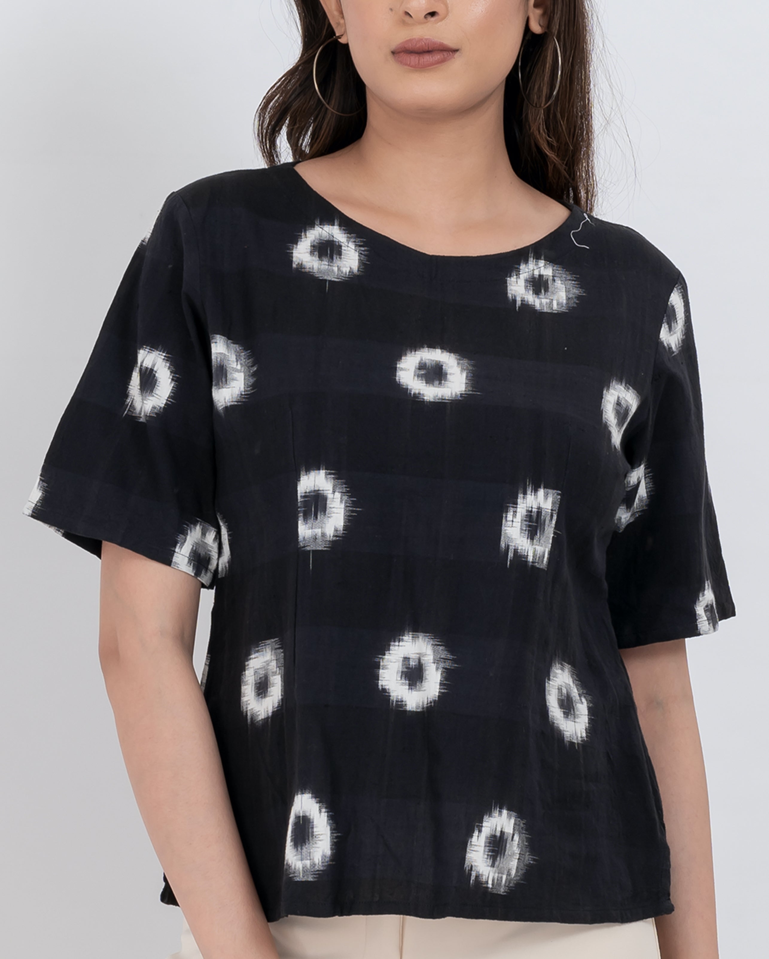 Abstract print short sleeve top with circular patterns