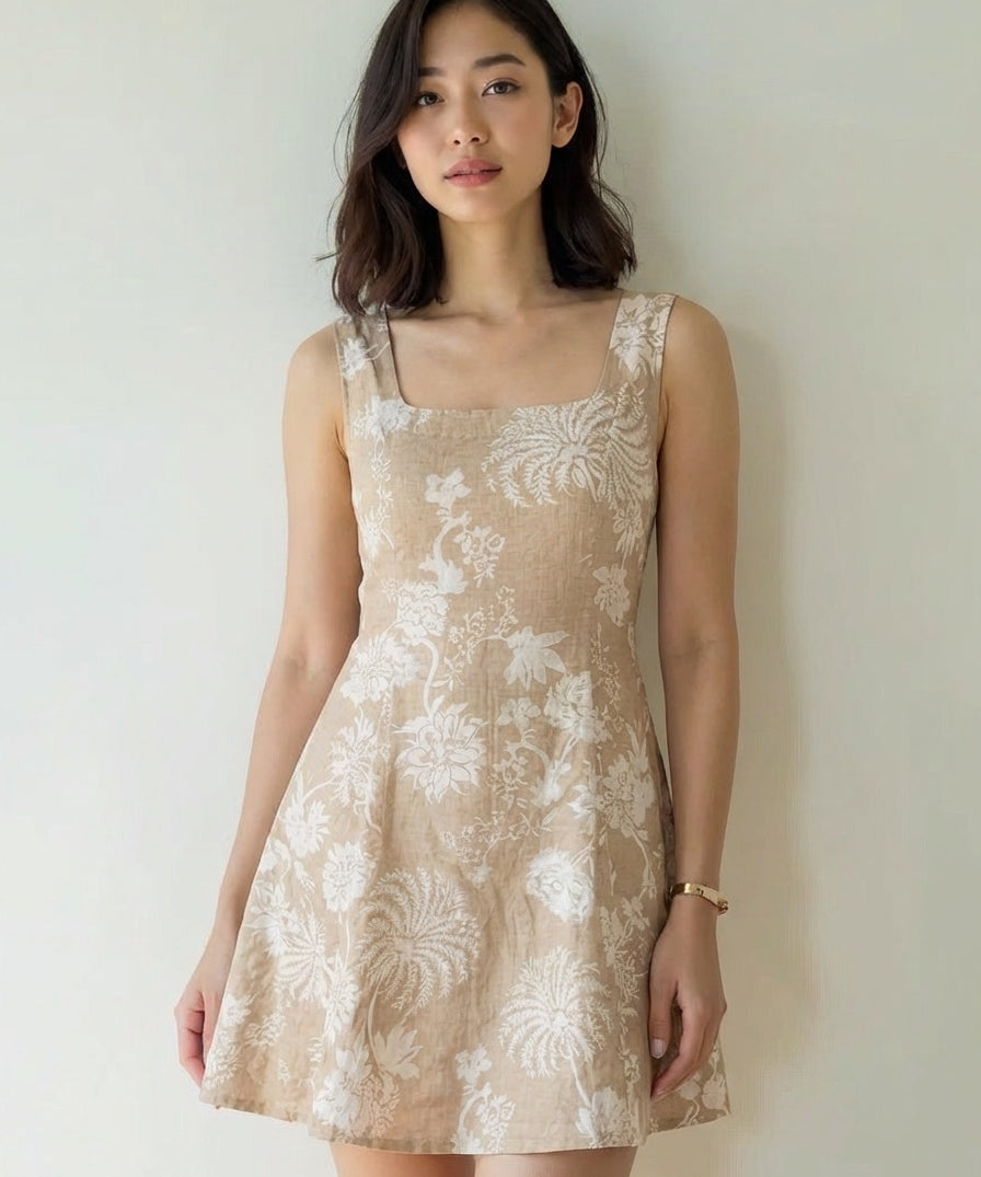 Woman wearing a beige floral dress