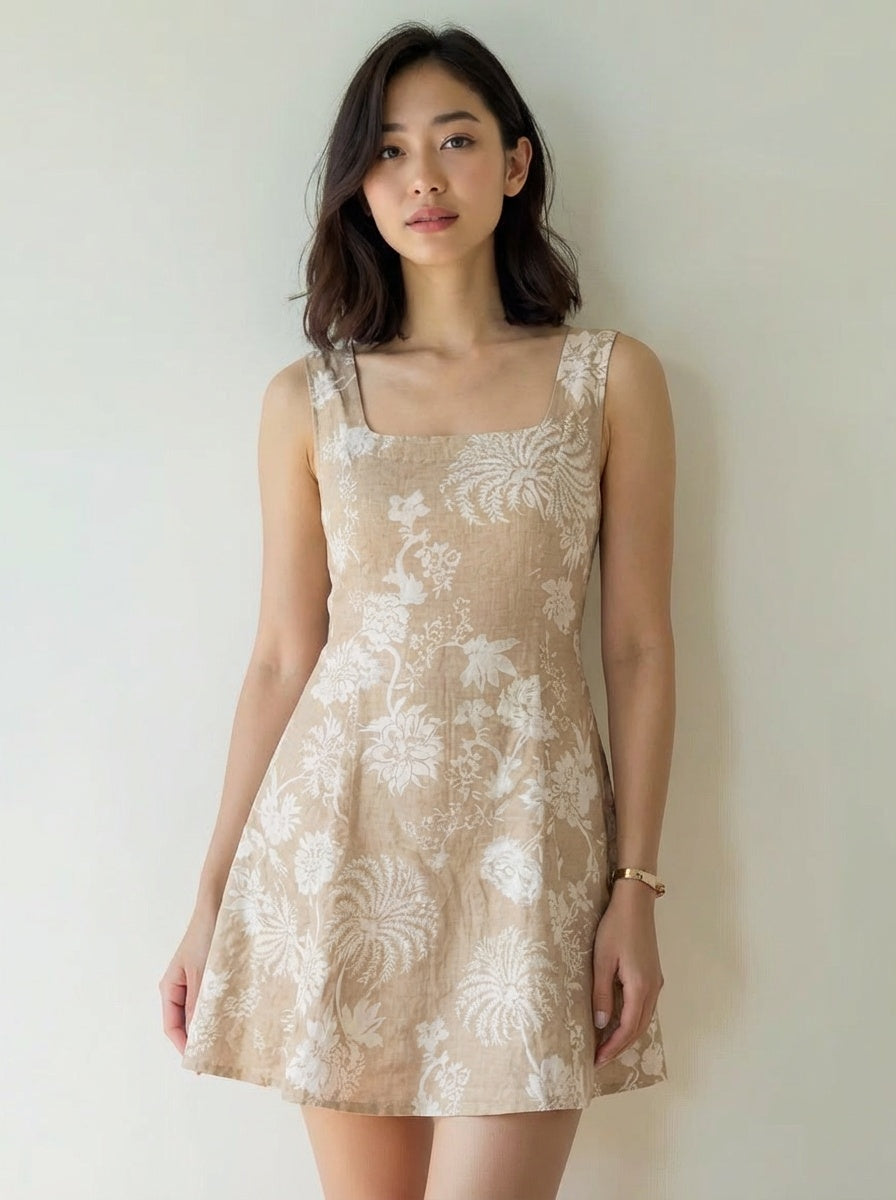 Woman wearing a beige floral dress
