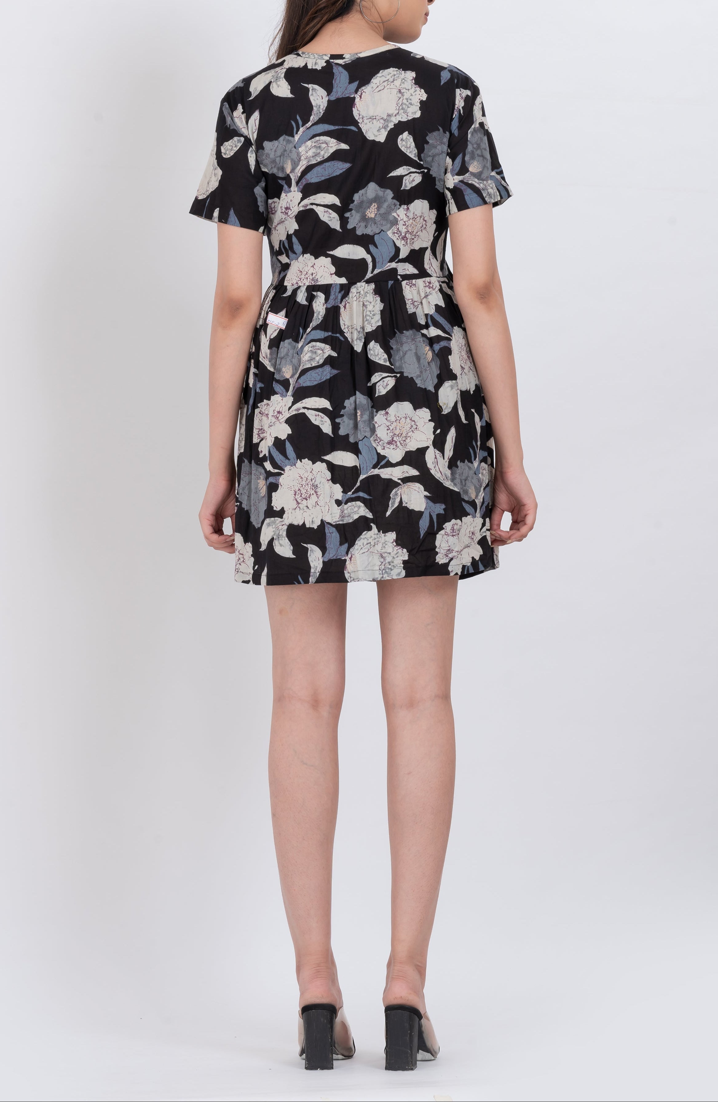 Black floral print babydoll dress with adjustable tie neck detail