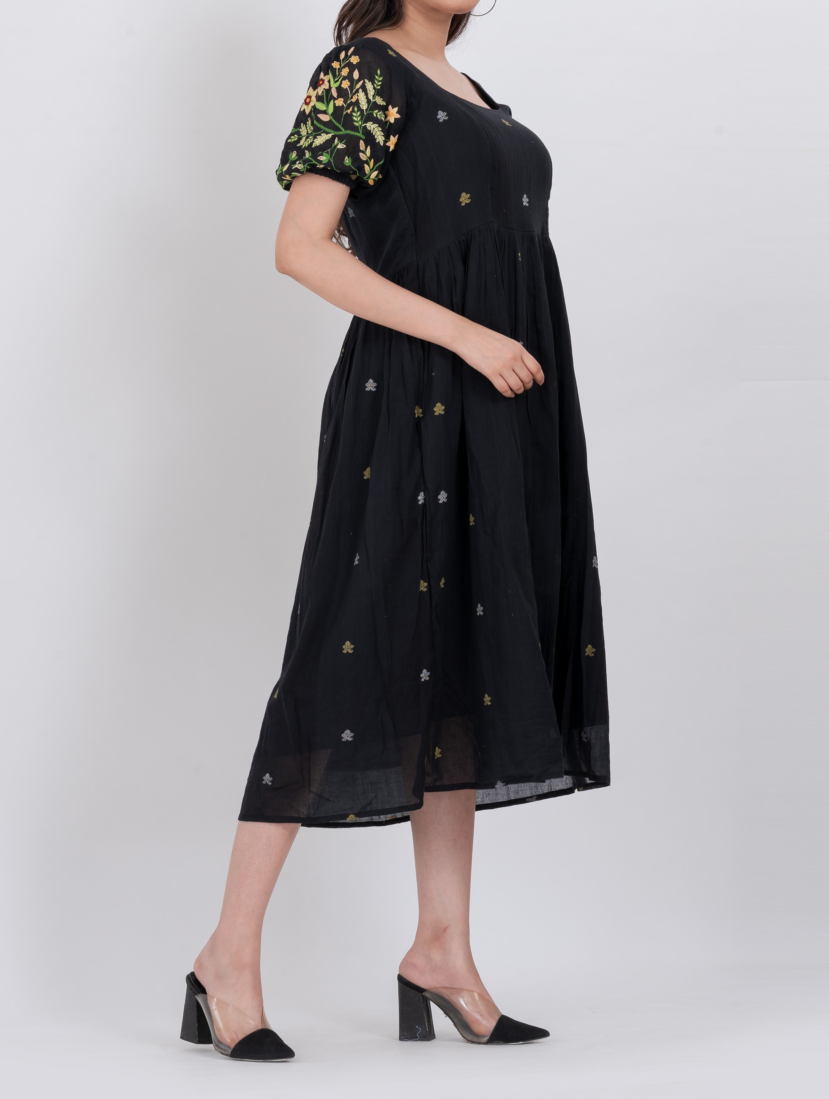Boho-inspired floral embroidered handwoven cotton dress with a tiered A-line cut and puffed sleeves.
