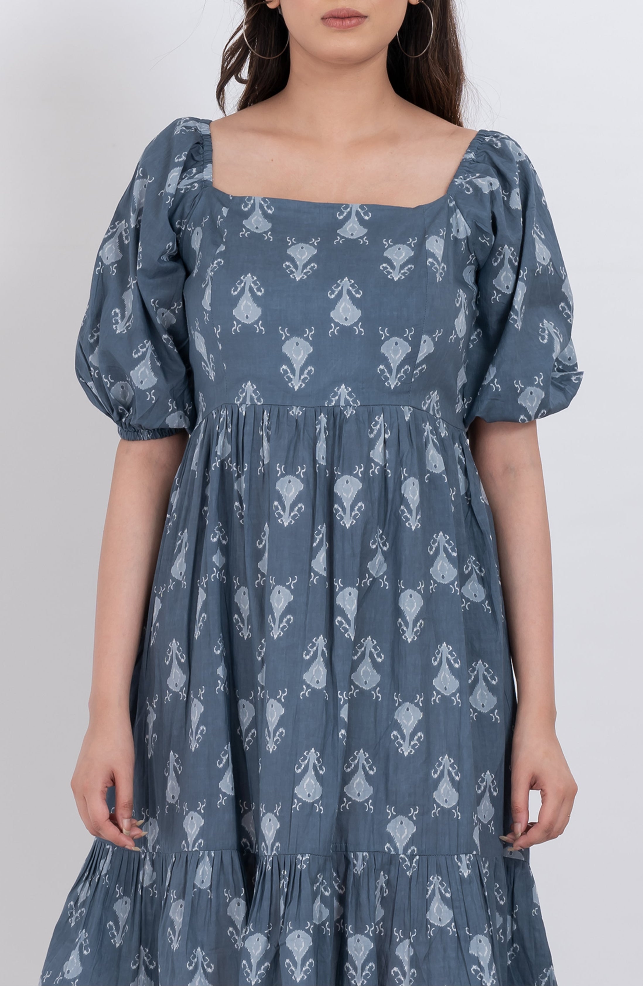 Square neck floral puff sleeve dress with flowy skirt and ruffled hem