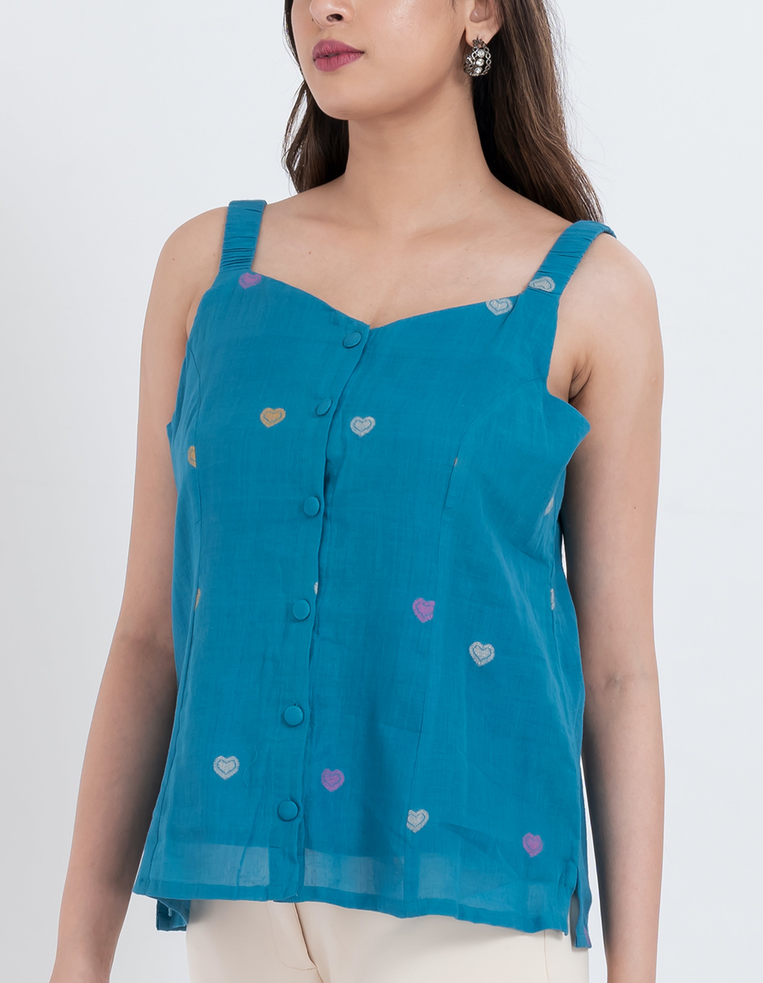 Sleeveless blouse with embroidered heart details