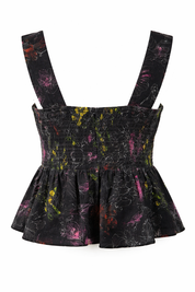Black floral patterned romper with suspenders on a white background
