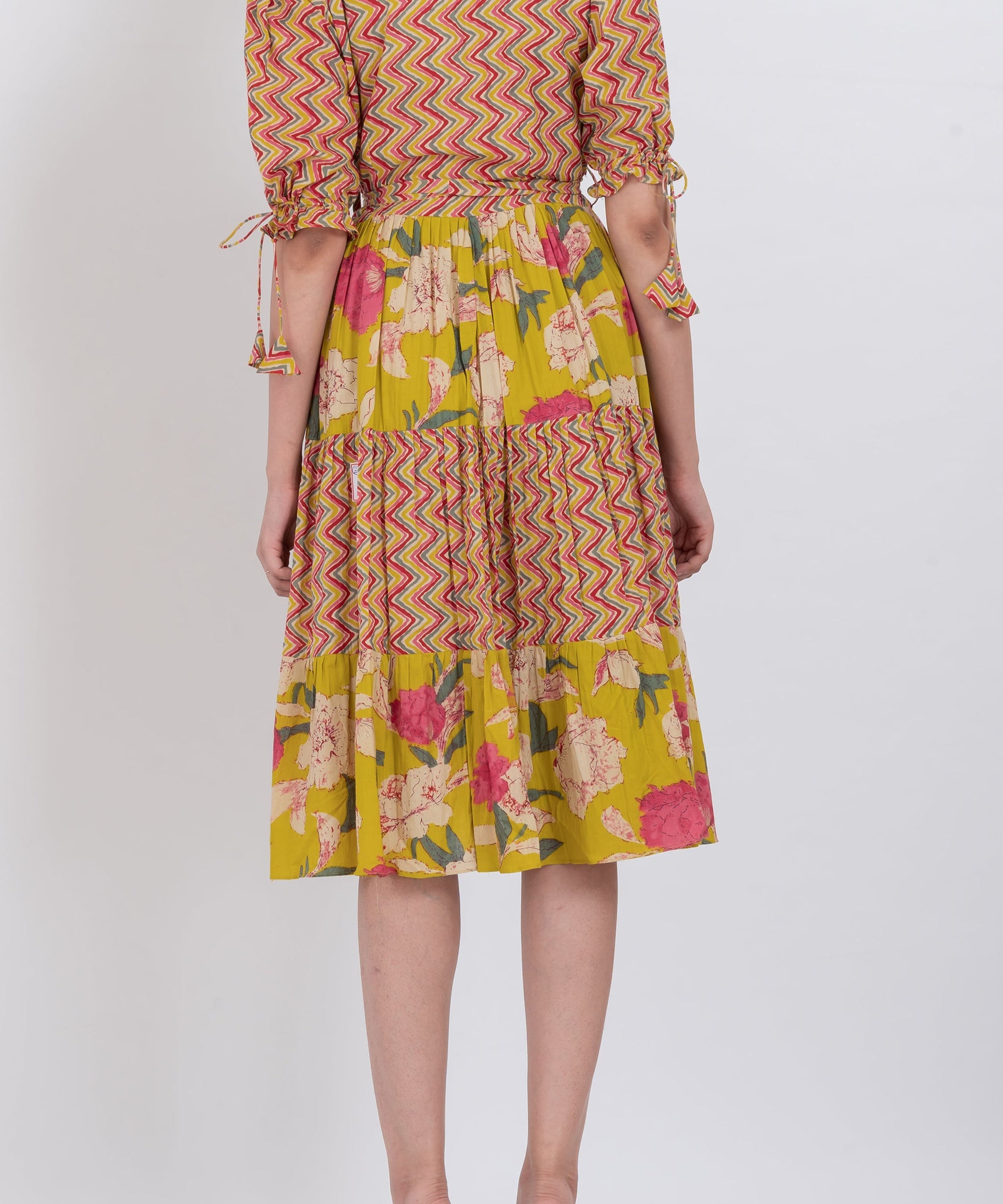 Colorful floral tie-waist dress with puff sleeves and a flattering V-neckline