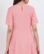 Short sleeve cotton dress with a button-up front and scalloped hemline for added charm