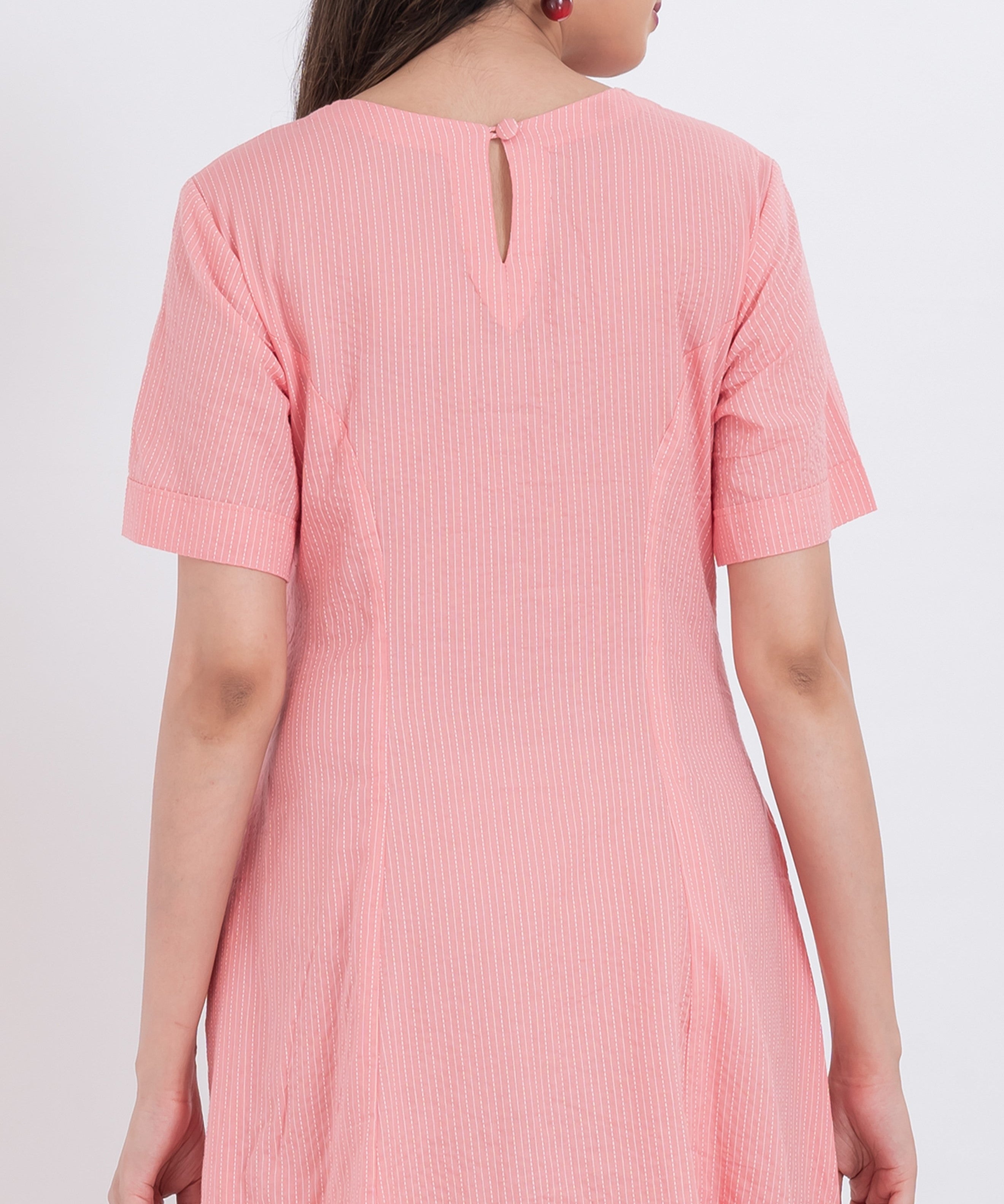 Short sleeve cotton dress with a button-up front and scalloped hemline for added charm