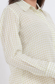 Close-up of the grid check pattern on a long sleeve shirt