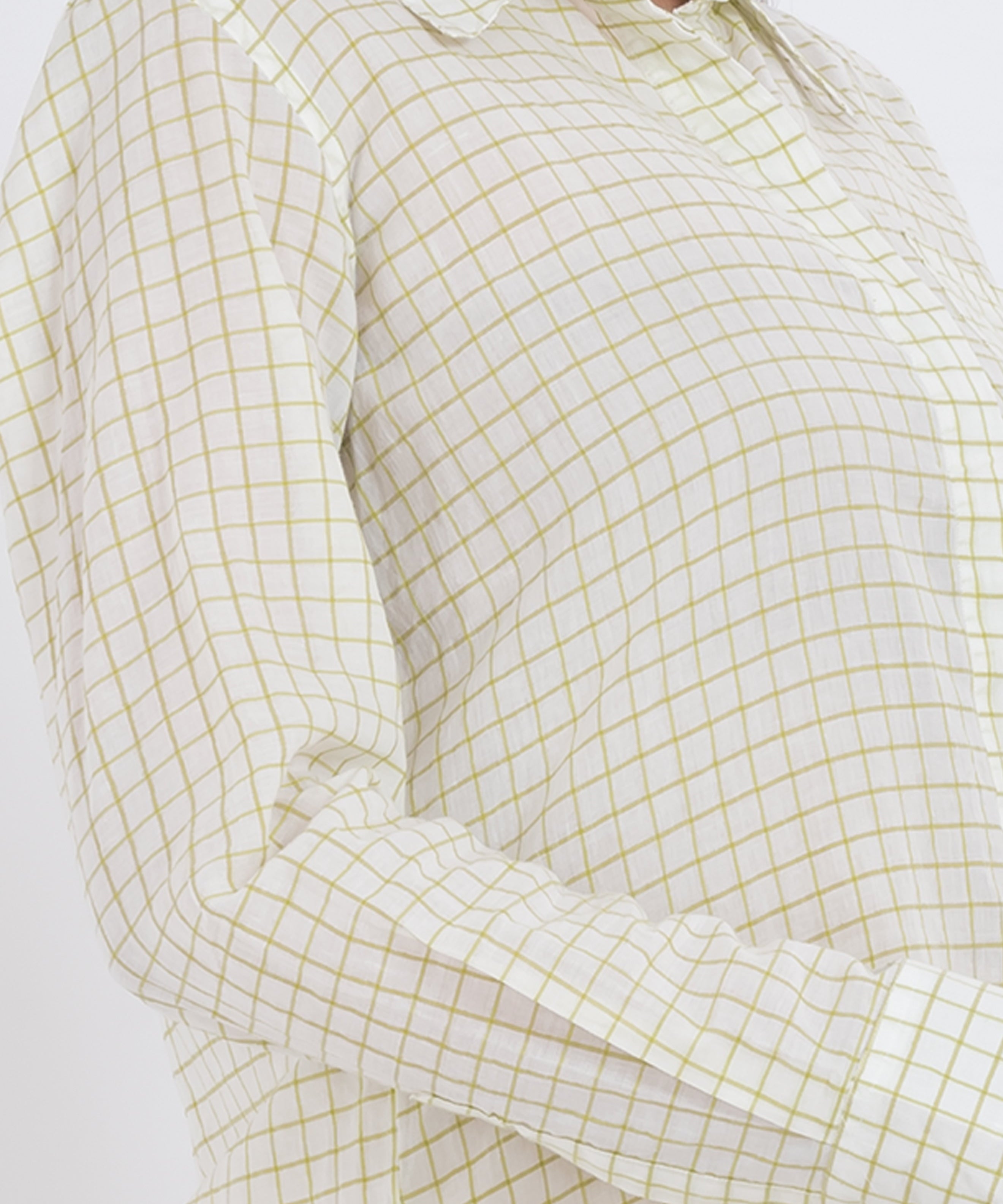 Close-up of the grid check pattern on a long sleeve shirt