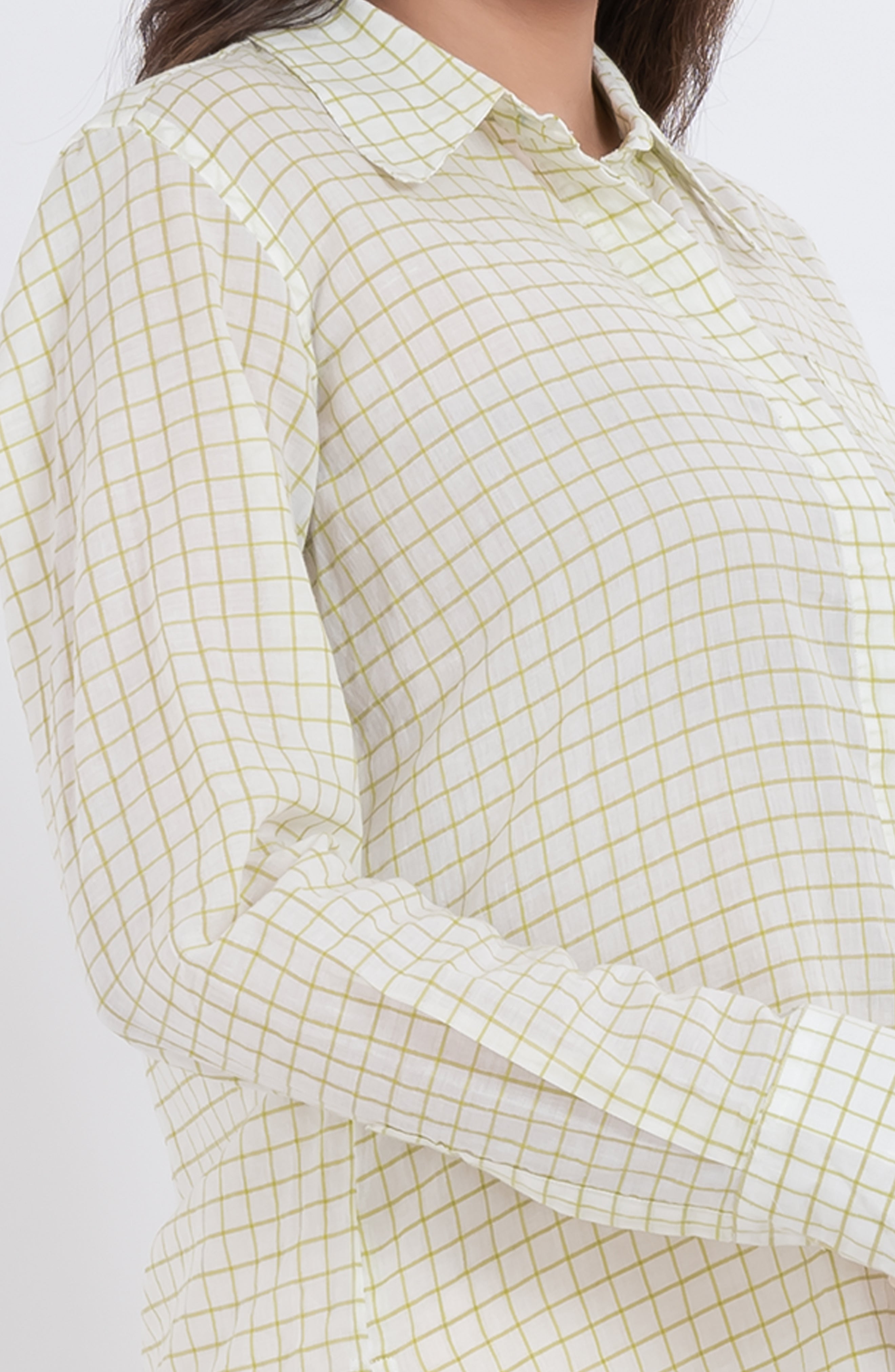 Close-up of the grid check pattern on a long sleeve shirt