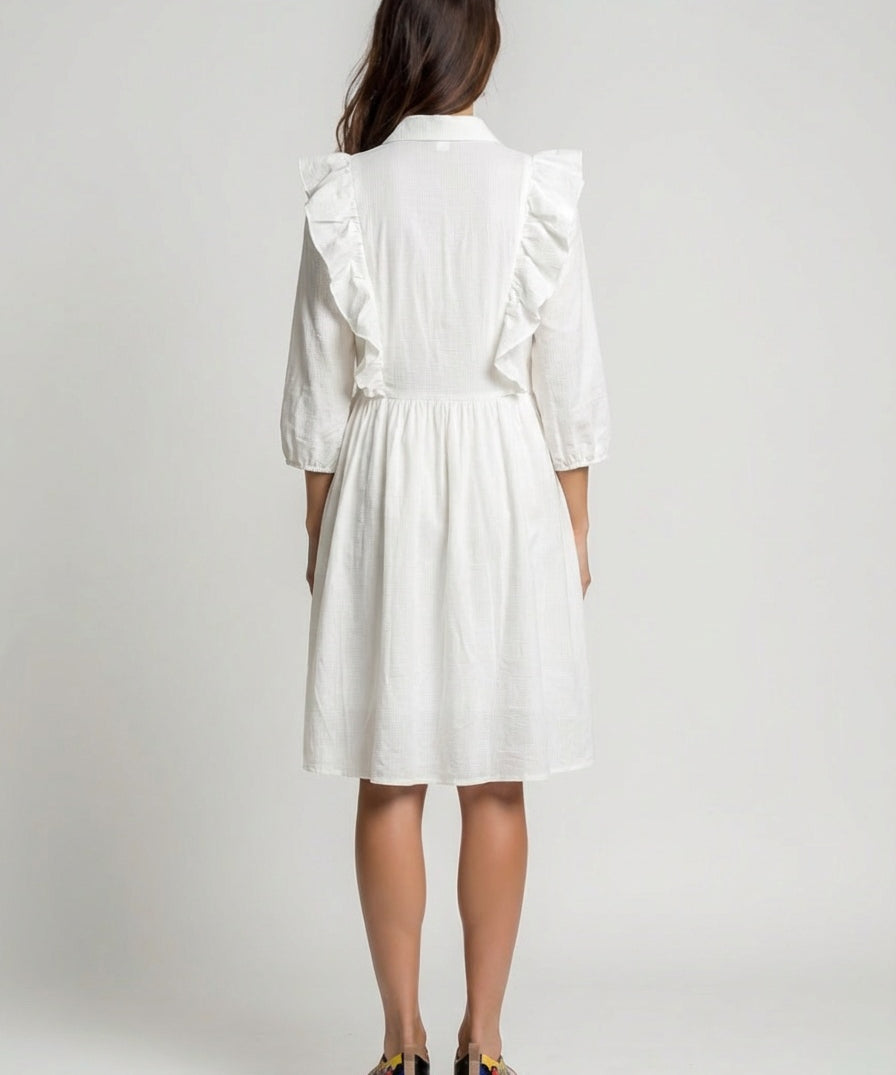 women wear white dress with ruffled sleeves