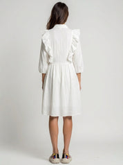 women wear white dress with ruffled sleeves