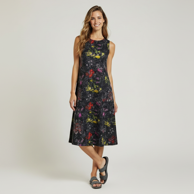 Woman wearing a floral dress on a plain background