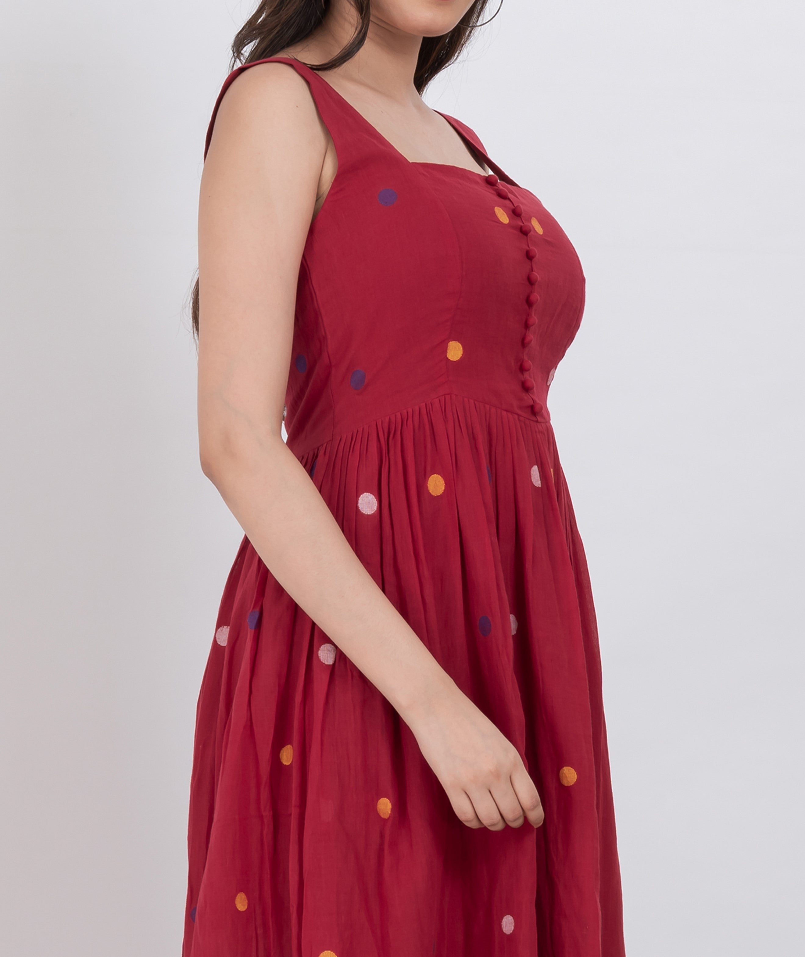  Comfortable handwoven cotton polka dot dress with button front and A-line cut, perfect for sunny days.