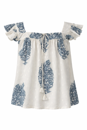 White dress with blue floral patterns on a white background