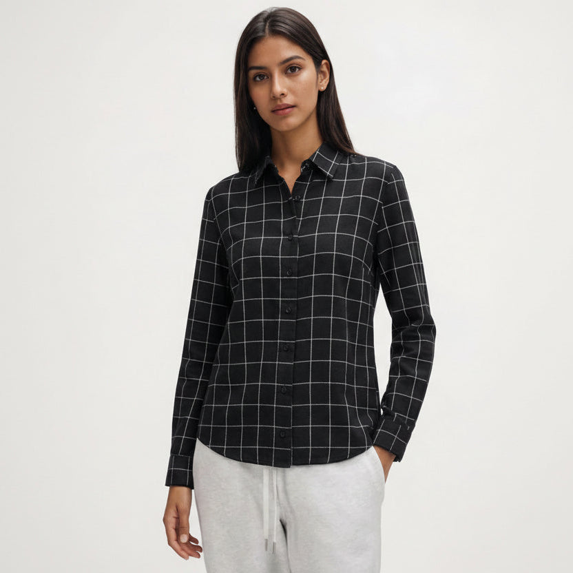 Woman wearing a black checkered shirt on a white background