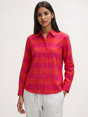 Woman wearing a red and pink plaid shirt soft fabric