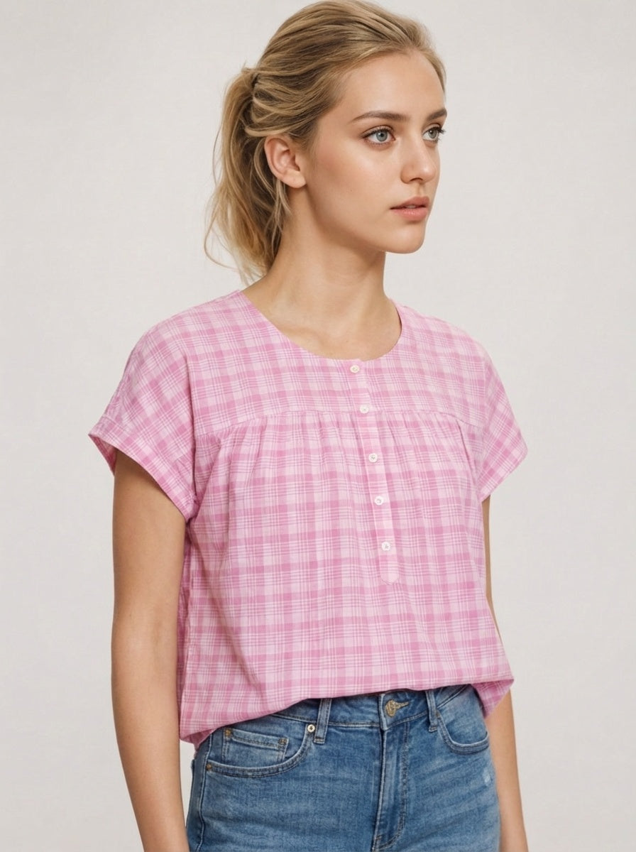 Woman wearing a pink checkered shirt best ootd