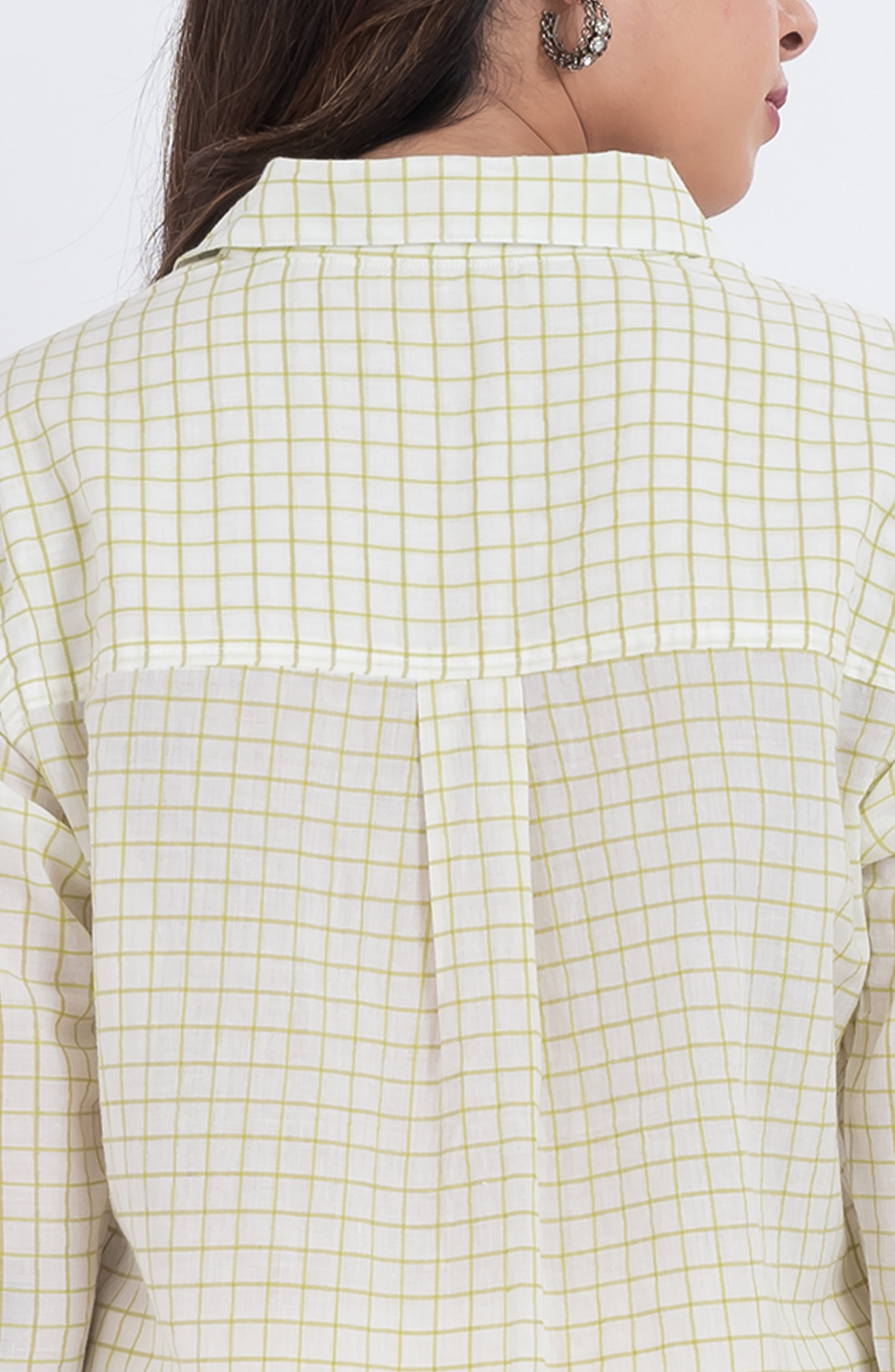 Model wearing a relaxed fit grid print shirt for women
