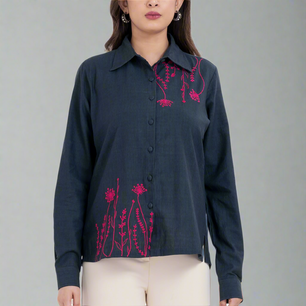 Embroidered floral button-up shirt with long sleeves.