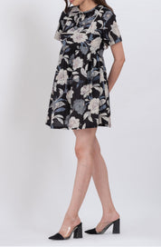 Black floral babydoll dress with tie neck and relaxed fit for comfort