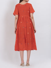  A-line floral handwoven cotton dress with short sleeves and pleated design for a comfortable fit.