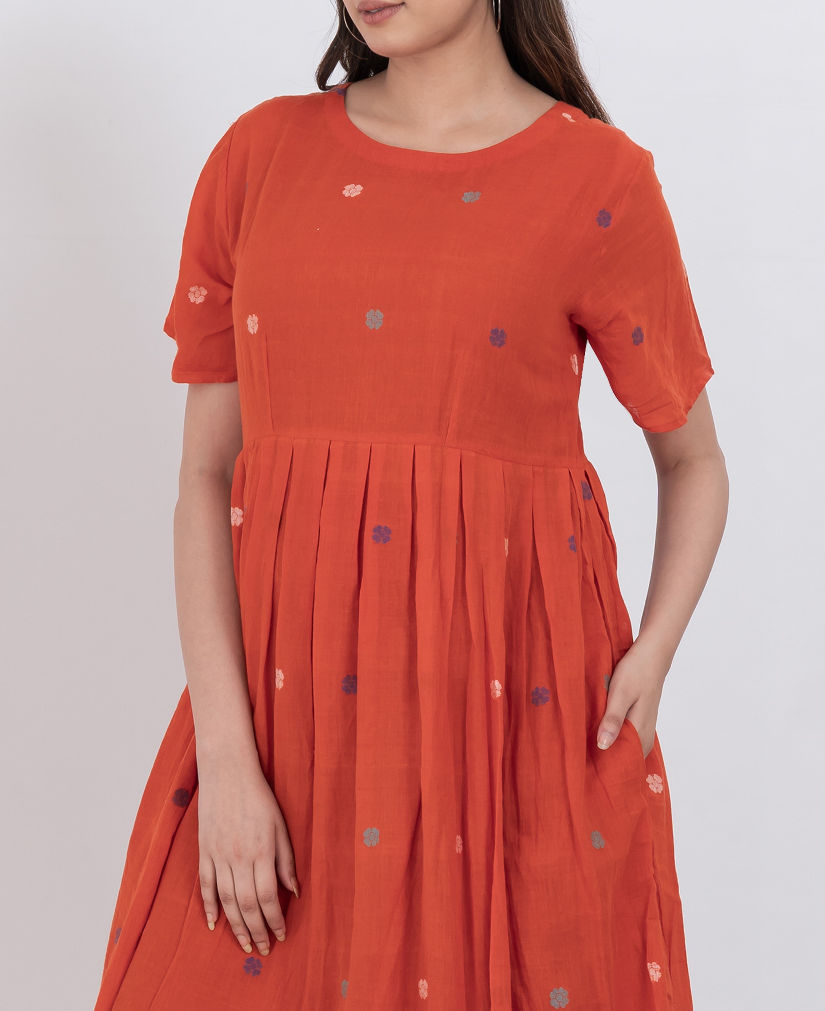  Floral embroidered handwoven cotton dress with pleated A-line cut and short sleeve design.