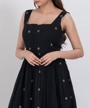  Handwoven cotton floral embroidered dress featuring button front and A-line silhouette.