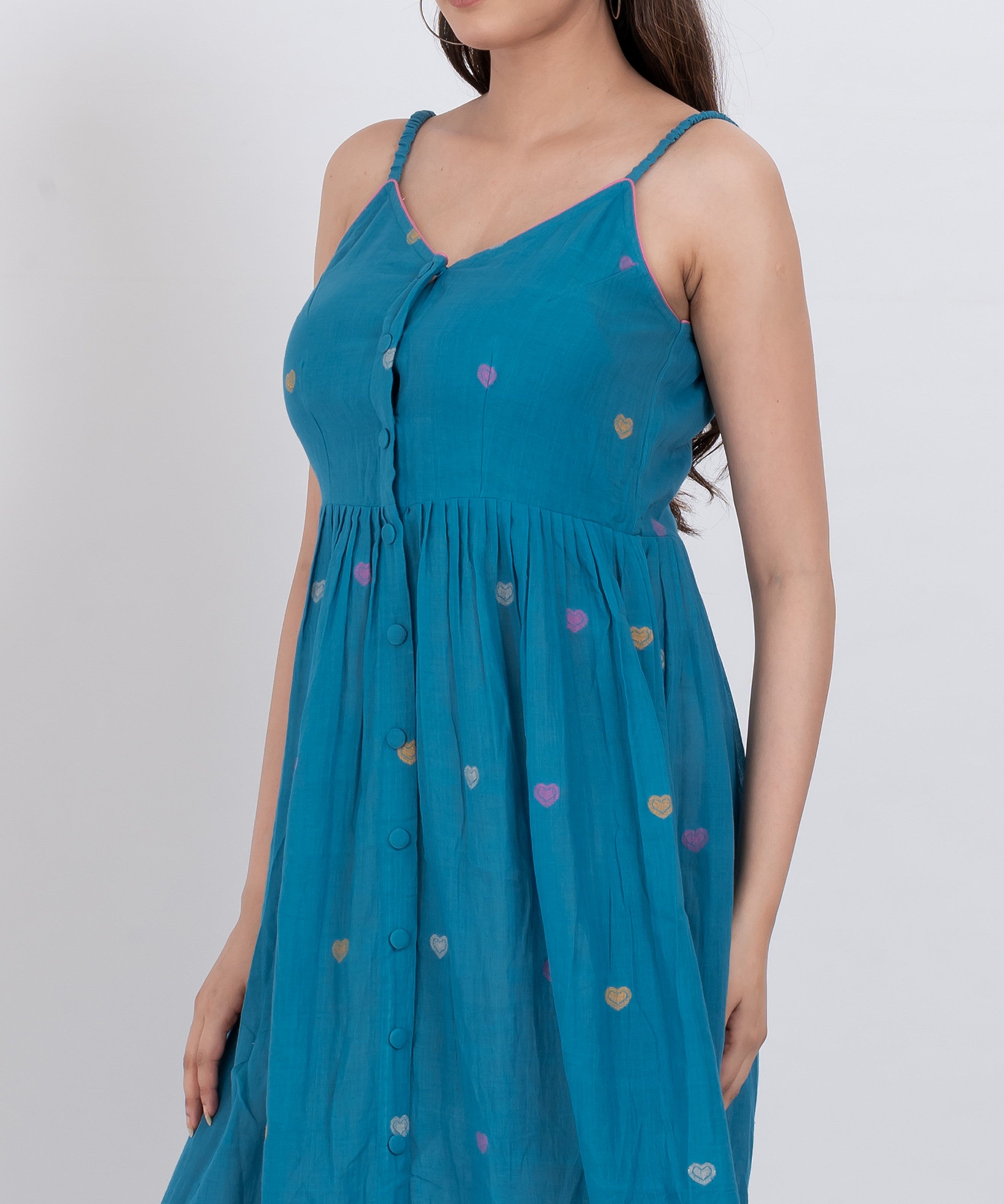 A-line handwoven cotton dress with heart print and button-down front, offering a feminine fit.