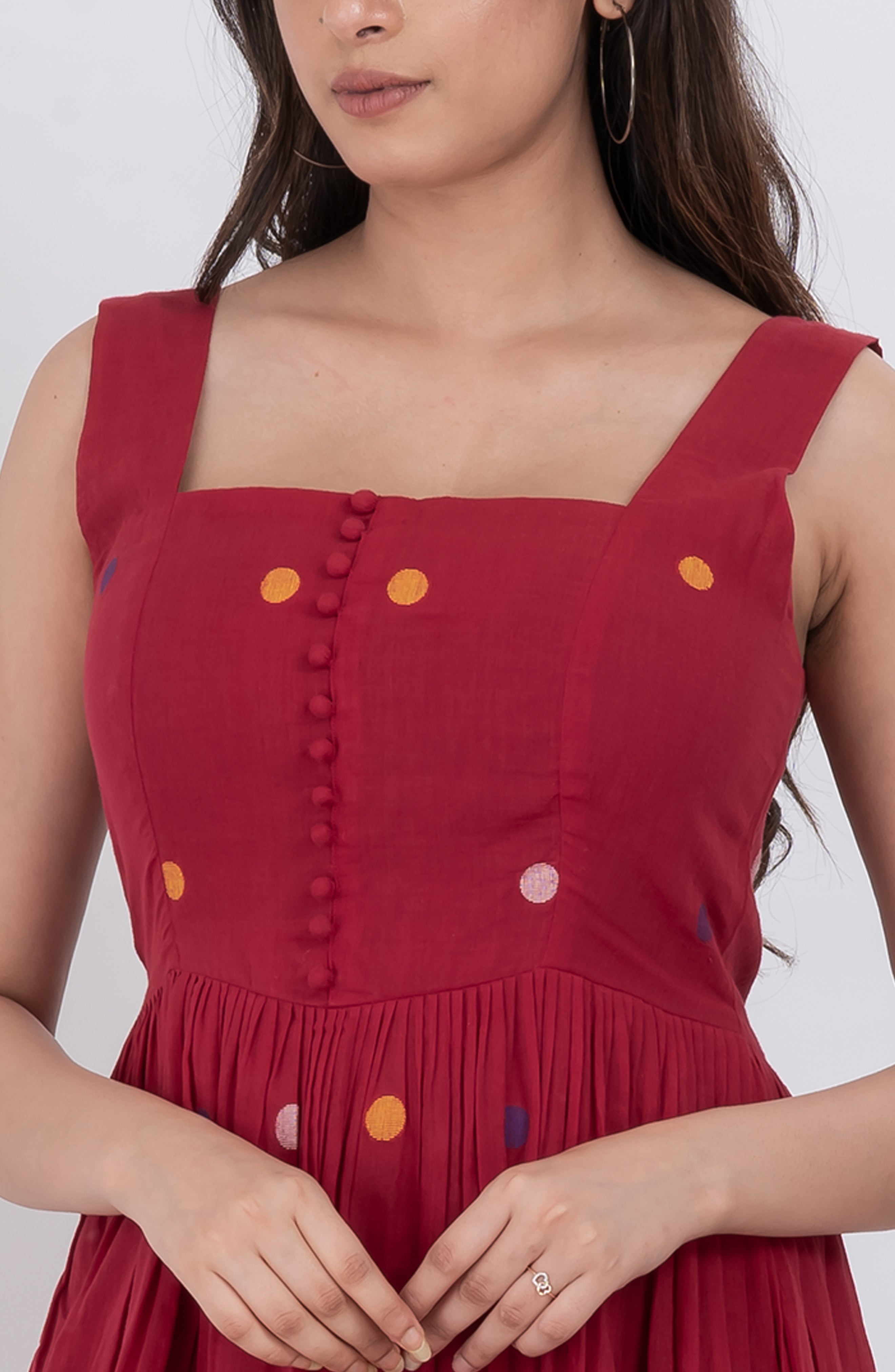  Handwoven cotton floral polka dot dress featuring button-down front and flattering A-line fit.