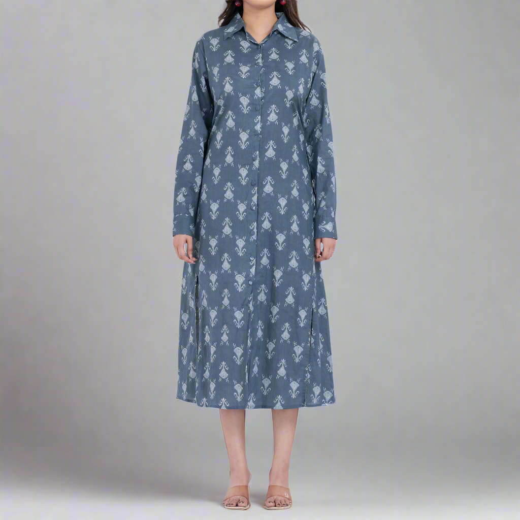 Model wearing a floral print shirt dress with a belted waist, giving the dress a flattering silhouette.