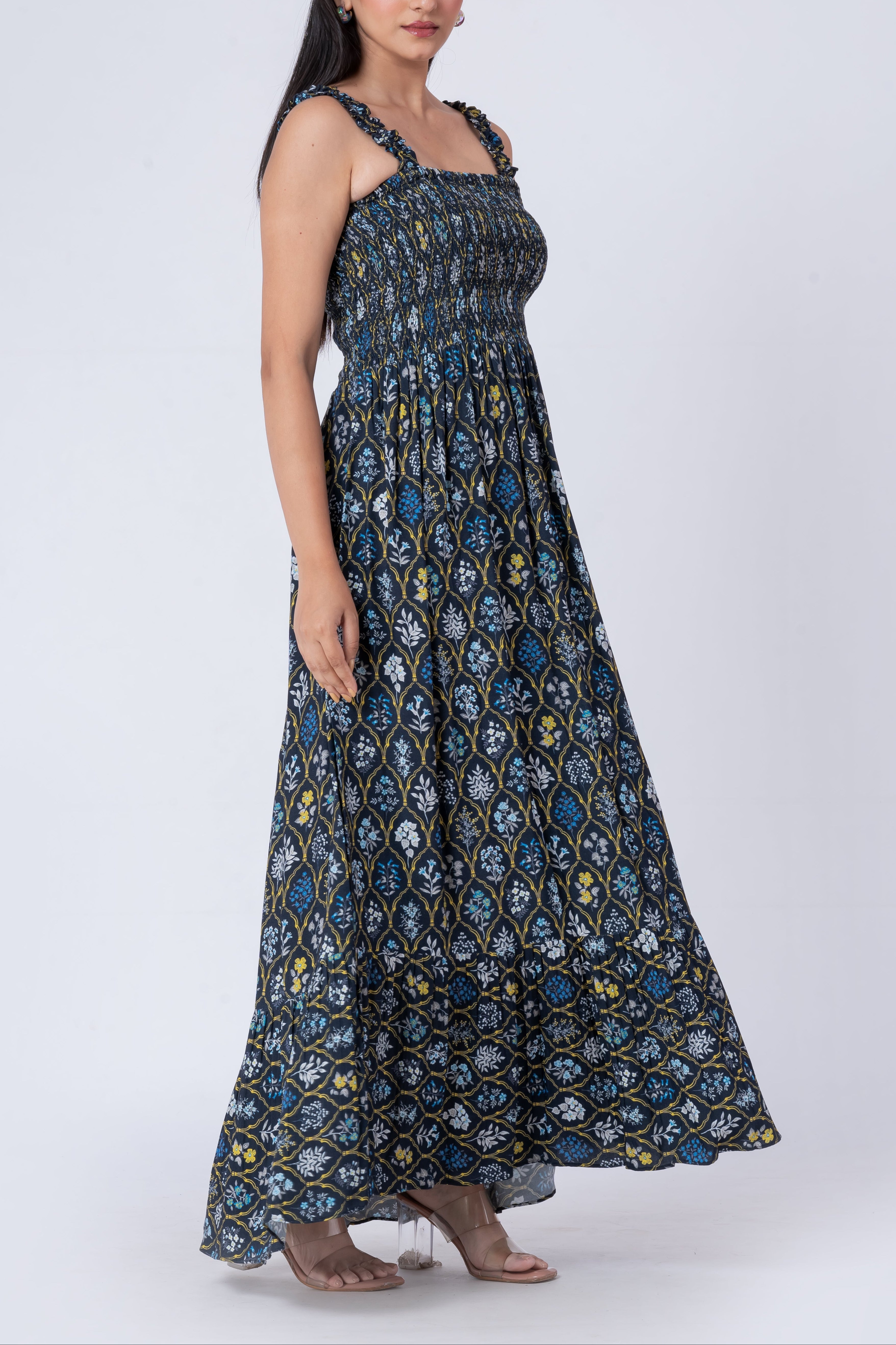 Floral print maxi dress featuring adjustable straps and a flowy skirt.