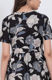 Cute floral babydoll dress with V-neck tie neck detail and flowy skirt