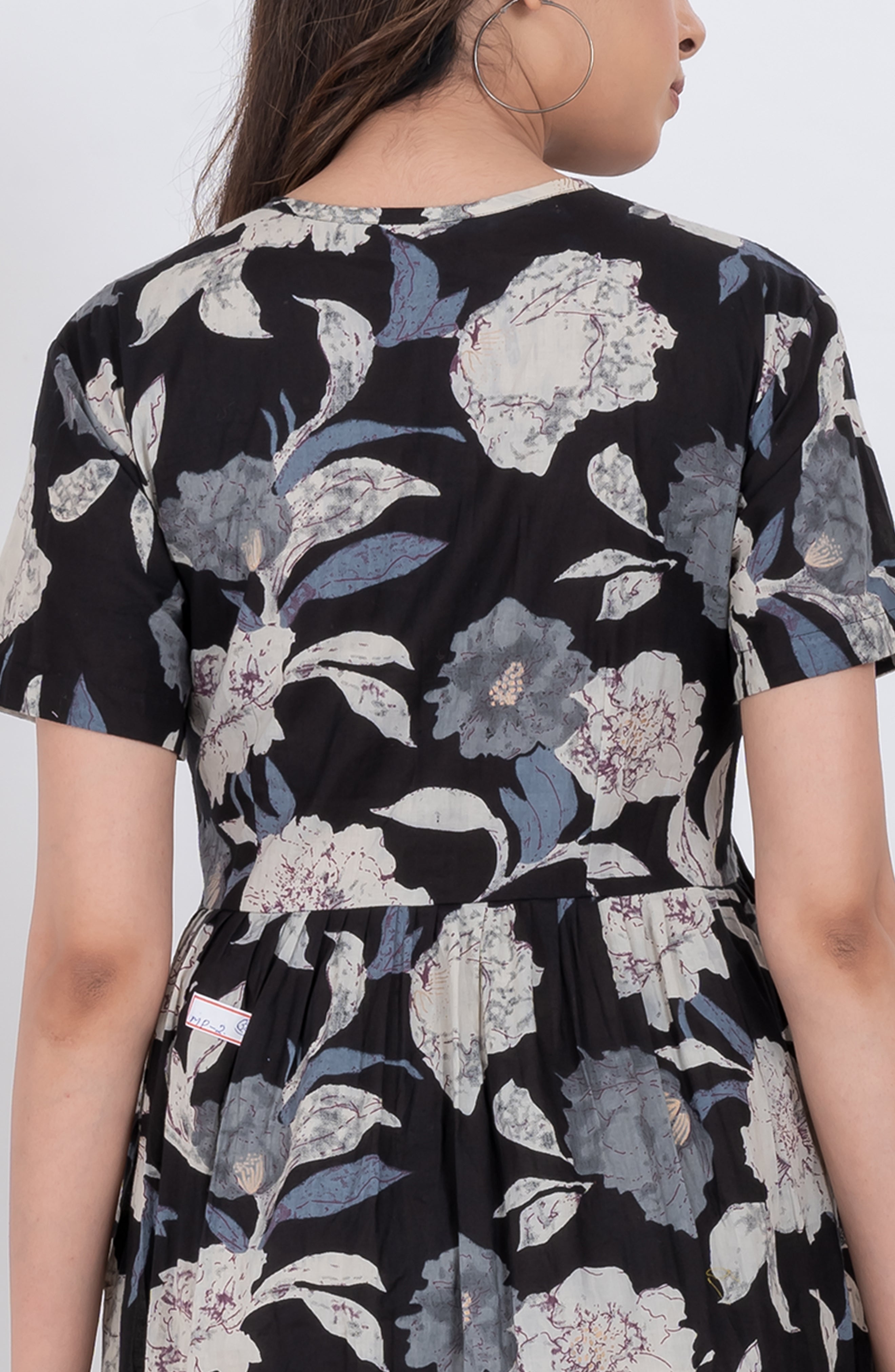 Cute floral babydoll dress with V-neck tie neck detail and flowy skirt