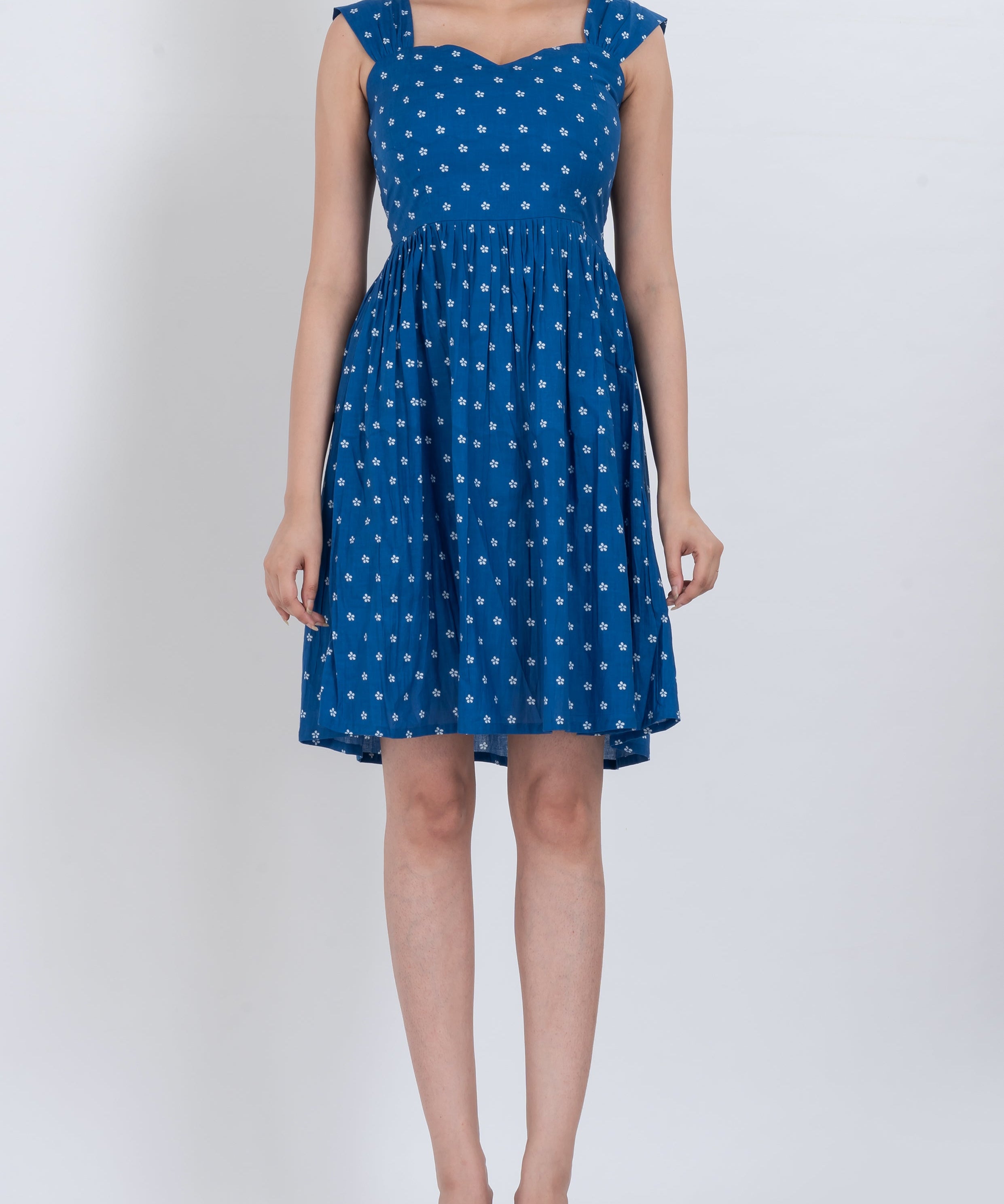 Floral V-neck tie shoulder dress with pleated skirt and adjustable straps