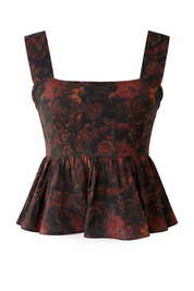 Floral patterned dress with a peplum waist on a white background