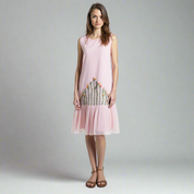 model wearing sleeveless cotton silk midi with hand embroidered floral panel