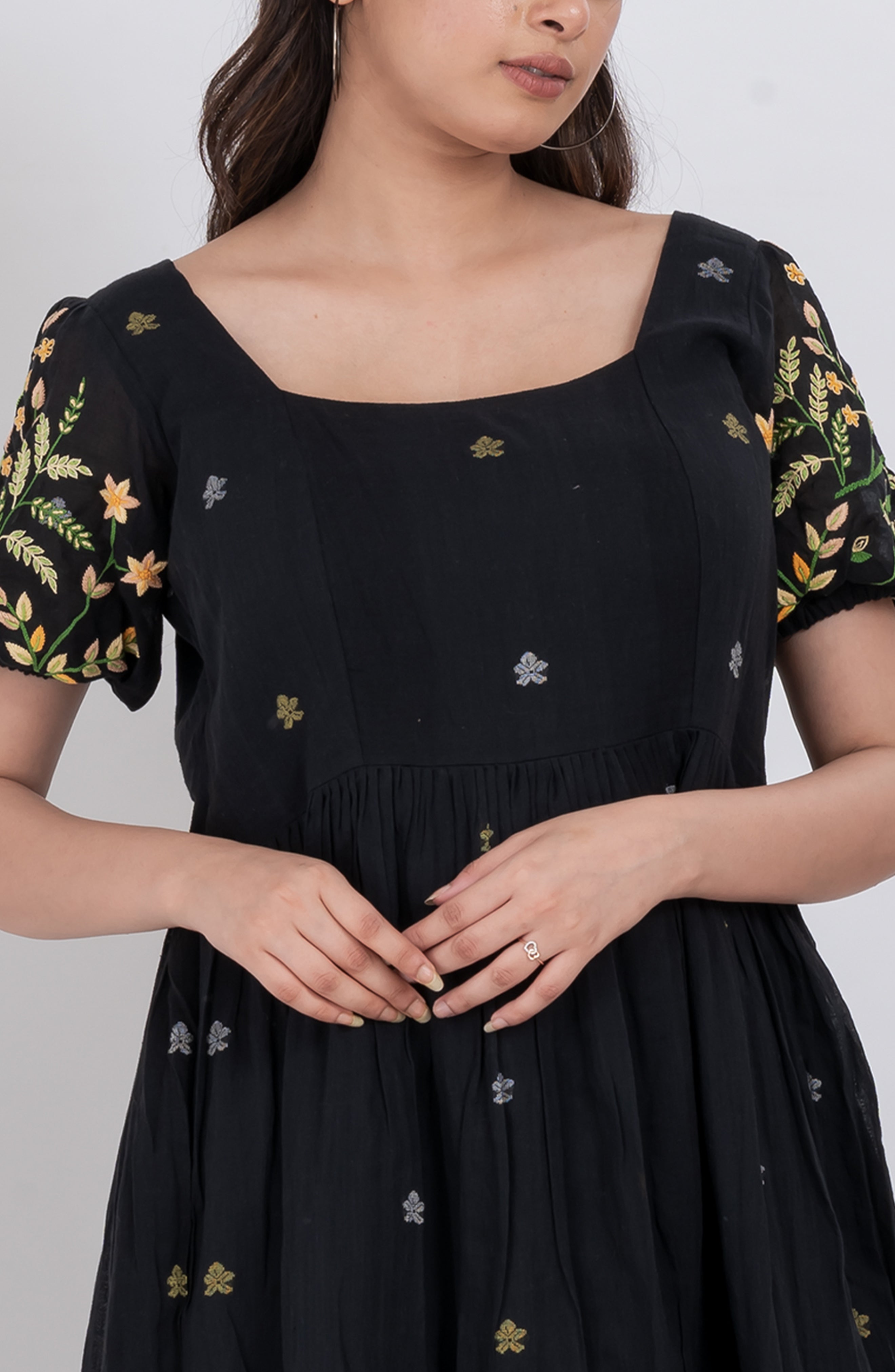 Elegant handwoven cotton floral dress with puffed sleeves and a flattering square neckline. 
