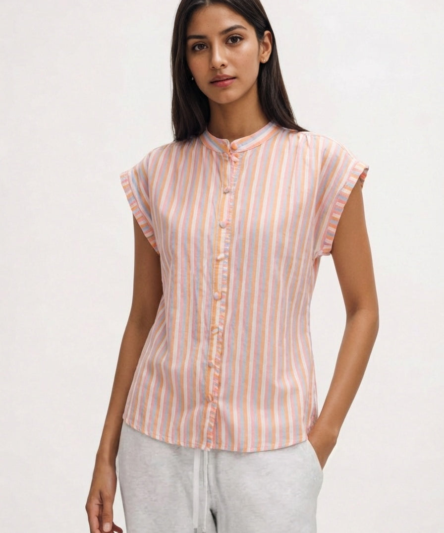 Woman wearing a striped shirt with a plain background