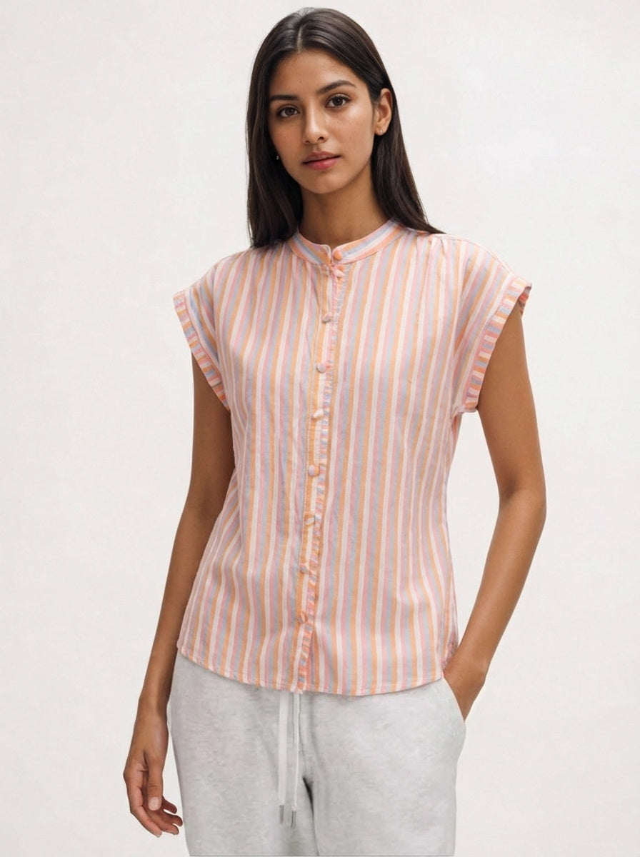 Woman wearing a striped shirt with a plain background