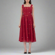 Handwoven cotton polka dot dress with button front closure and A-line silhouette.