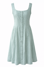 Light green sleeveless dress with buttons on a white background