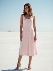 Woman wearing a light pink sleeveless dress ootd