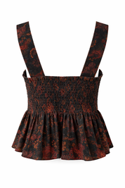 Black and red patterned top with suspenders on a white background