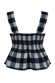 Blue and white checkered dress with suspenders on a white background